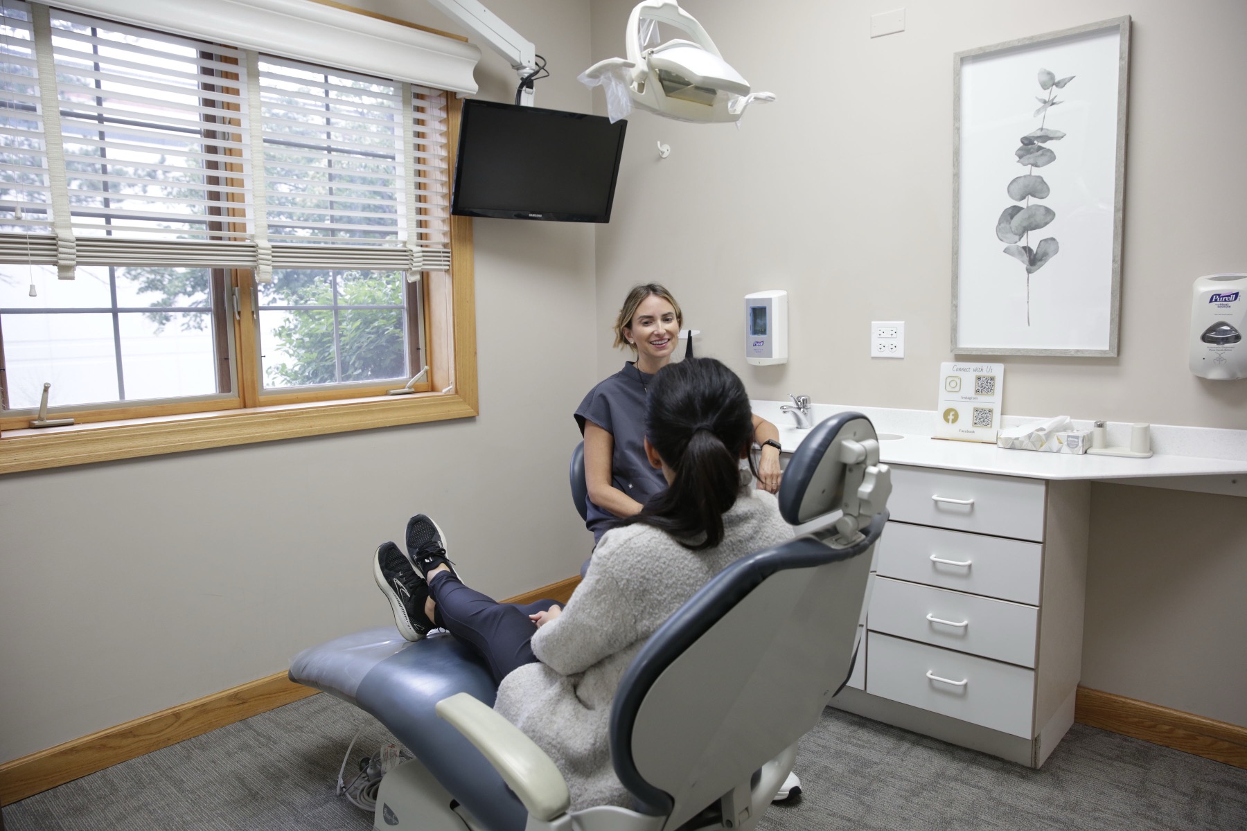 Modern dental treatment room with patient monitor