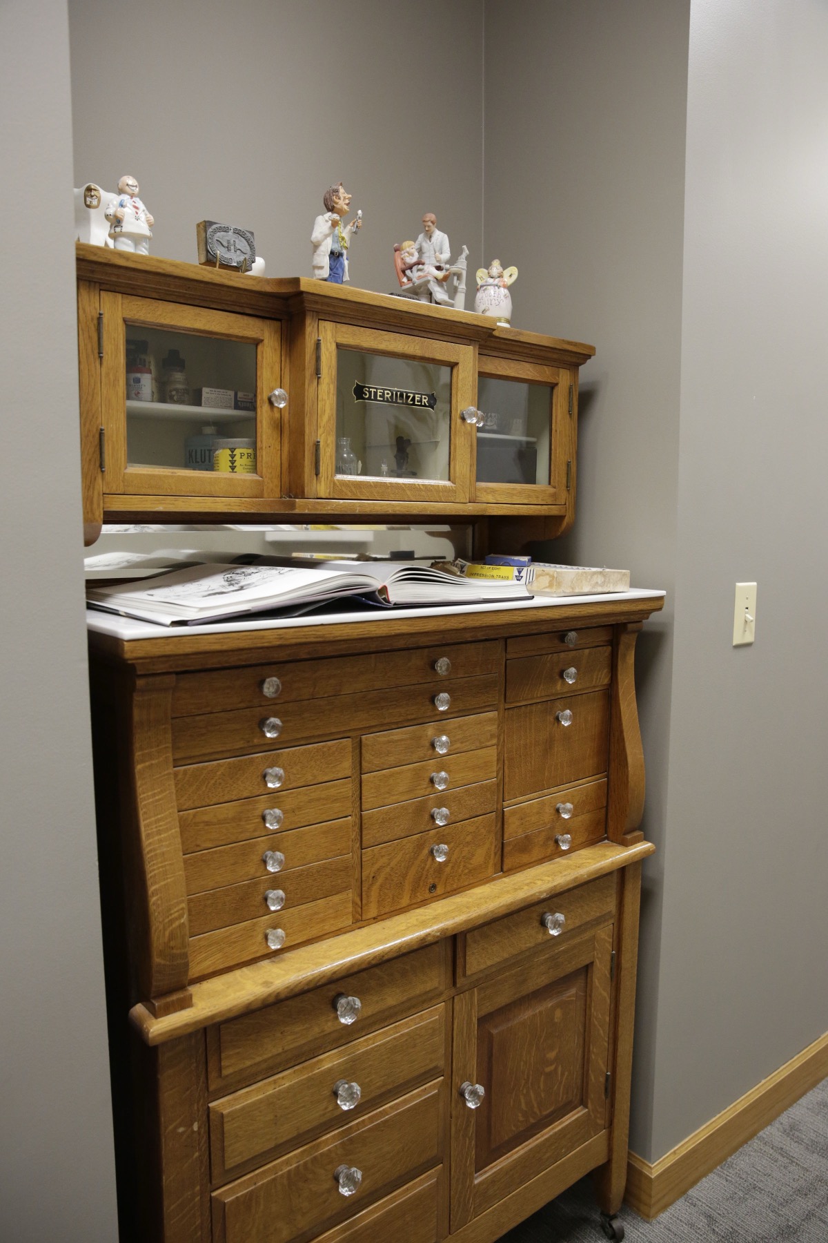 Antique sterilizer cabinet, a heritage detail in our Orland Park office