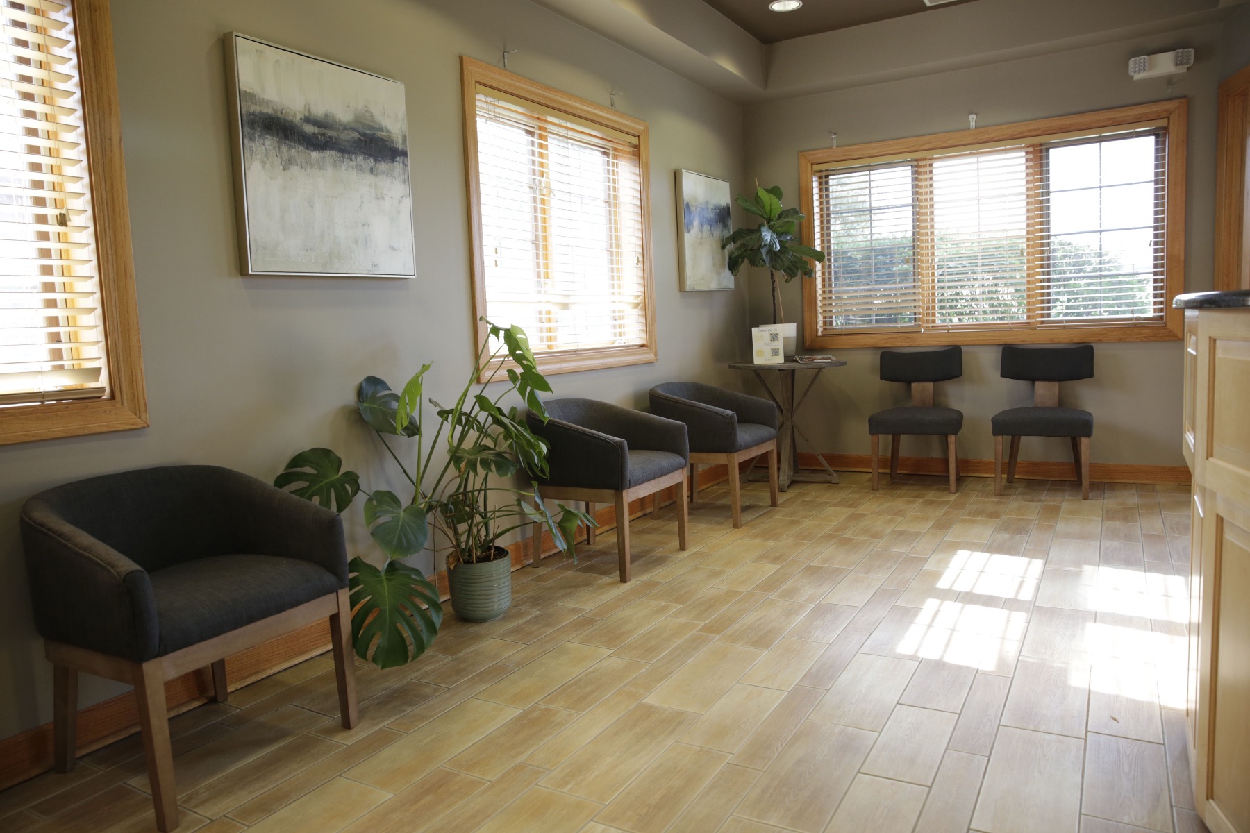 Comfortable waiting room with natural light at our Orland Park office